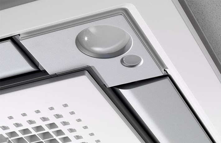 Close-up of a ceiling cassette air conditioning unit